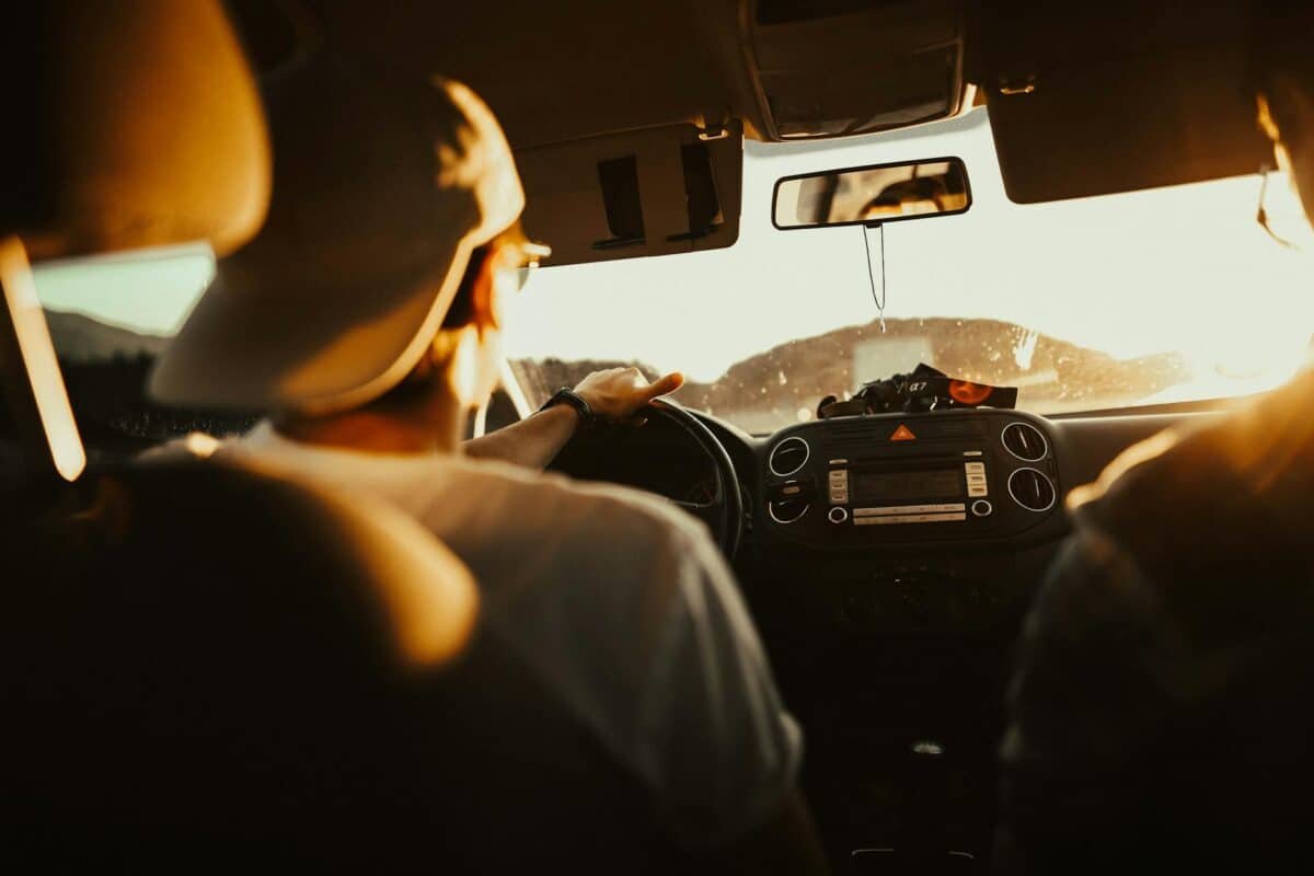 2 boys driving car
