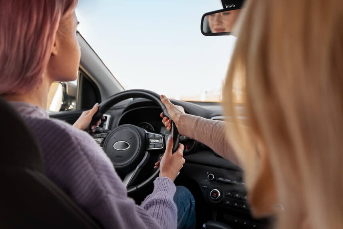 2 girls driving car