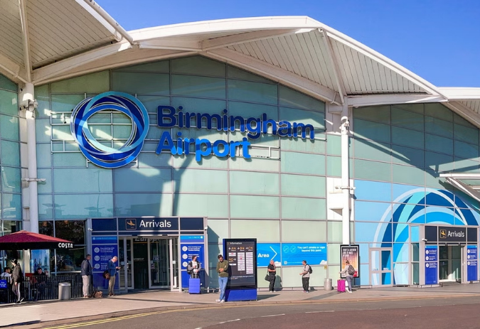 Birmingham Airport arrivals entrance under white canopy