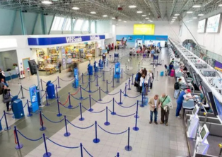 BHX check‑in area showing baggage drop and passenger queues
