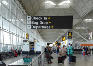 Check‑in and bag drop area at London Stansted Airport terminal – Stansted Airport Taxi drop‑off