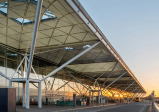 London Stansted Airport terminal canopy at sunset – Stansted Airport Taxi collection point